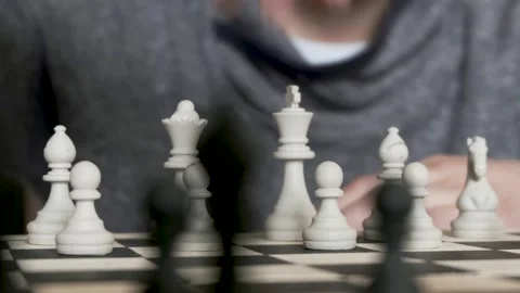 Cute boy playing chess. the concept of childhood and board games, brain developm Stock Footage 107660744