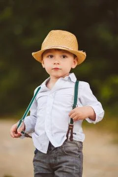 Cute boy playing in the park in the summer. Stock Photos