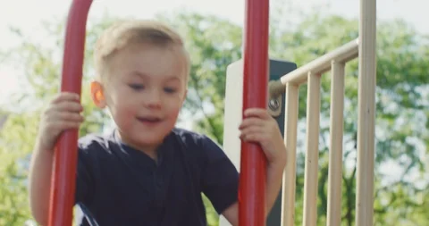 Cute boy playing in the playground Stock Footage 116113335