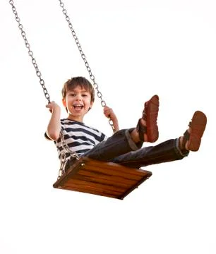 Cute boy playing on swing, having fun. On a white background. Stock Photos