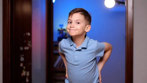 Cute boy posing and smiling at home in his room Stock Photos