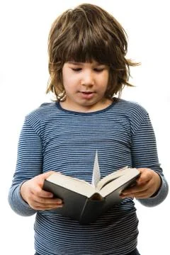 Cute boy reading bible Stock Photos