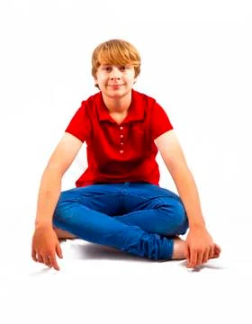 Cute boy sitting on the floor Stock Photos