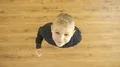 The cute boy stand and show thumb up 4k or 4k+ Resolution