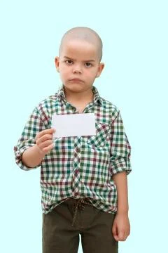 Cute boy standing with empty blank in hands, isolated on white Stock Photos