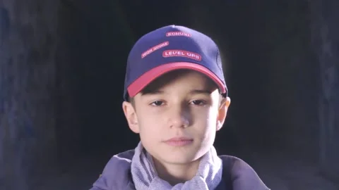 Cute boy is standing on a raleway front of a tunnel 库存影片 172584844