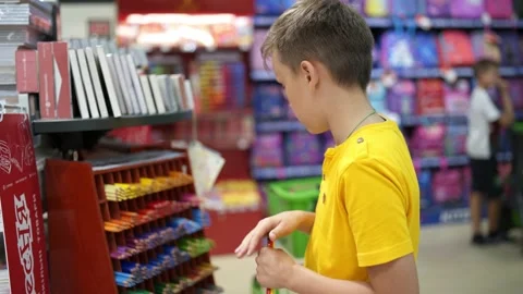 Cute boy in stationery store Stock Footage 139045704