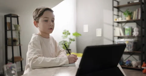 Cute boy study online watching webinar educational tutorial talking answering Stock Footage 277849028