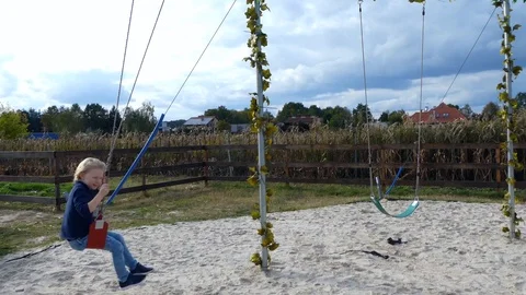 Cute boy on a swing. Stock Footage 118898699