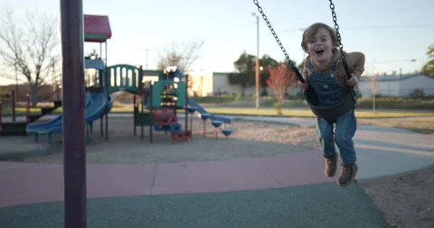 Cute Boy on The Swing in a Park Stock Footage 228847985