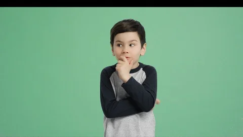 Cute boy thinking with a surprised expression - Alpha Channel, Green screen Stock Footage 129397069