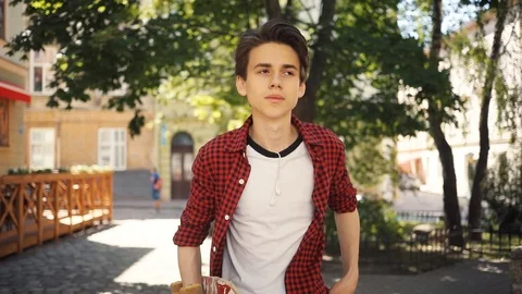Cute boy using a mobile phone walk keeps skate guy business fashion hand child Stock Footage 92050544