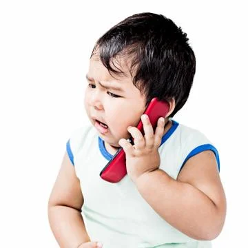 Cute boy using mobile phone Stock Photos