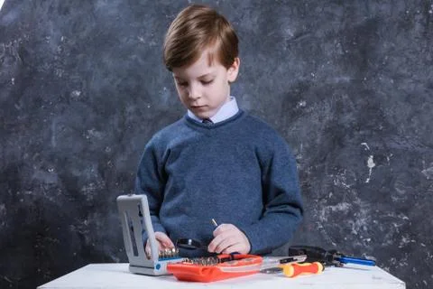 Cute boy with working tools studio portrait. Stock Photos