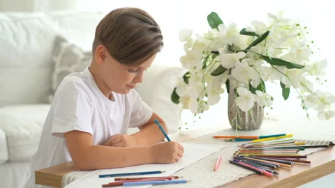 A cute boy writing with a pencil close up Stock Footage 115089982