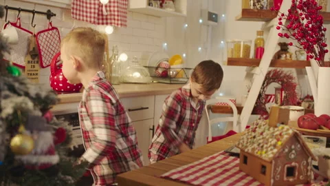 Cute boys dancing on the kitchen on Christmas Eve Stock Footage 265849752