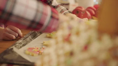 Cute boys making gingerbread icing cookies on Christmas Eve Stock Footage 265850847