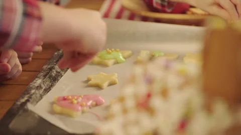 Cute boys making gingerbread icing cookies on Christmas Eve Stock Footage 265850926