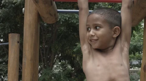 Cute Brazilian boy exercise on park background Stock Footage 42964207