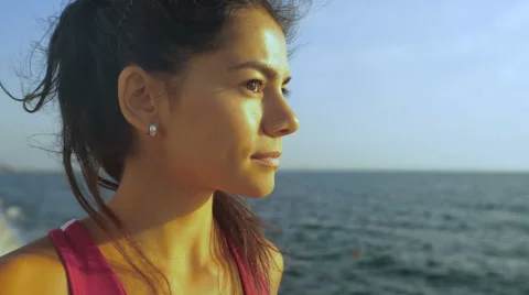 Cute brunette smiling on camera , staying on wooden boardwalk after morning Stock Footage 68856987