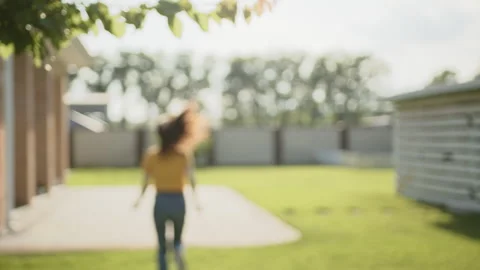 Cute brunette turning head to camera and winking, smiling broadly, running away Stock Footage 244377479