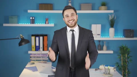 Cute businessman looking at camera getting happy. Video stock 231012177