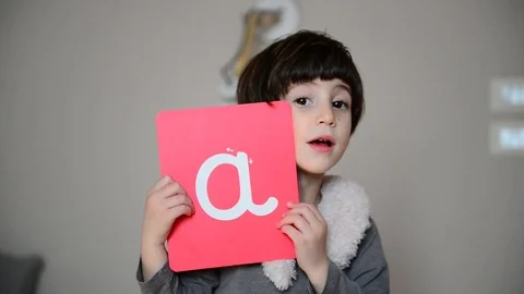 Cute caucasian child learns to write with Montessori letters 스톡 동영상 124946518