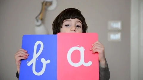 Cute caucasian child learns to write with Montessori letters 스톡 동영상 124947084