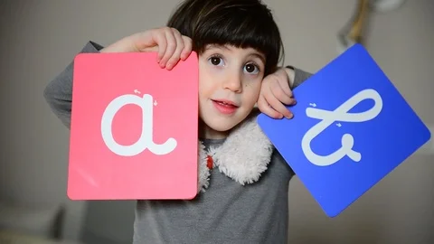 Cute caucasian child learns to write with Montessori letters 스톡 동영상 124947283