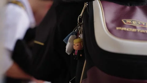 Cute Character Keychain Charm Hanging from Bus Driver Bag in Japan Stock Footage 337136003