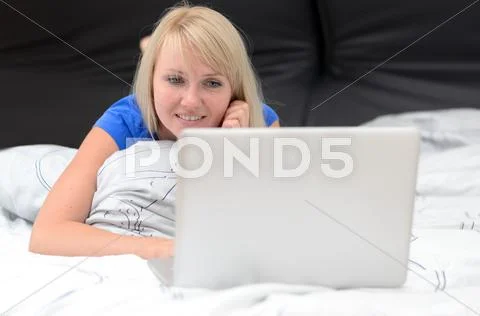Cute charismatic young blond woman Stock Photos