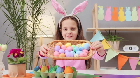 Cute charming satisfied brown haired little girl wearing bunny ears headband Vidéo 293239621