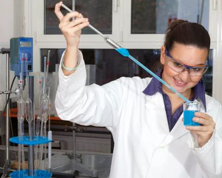 Cute chemist in laboratory Photos
