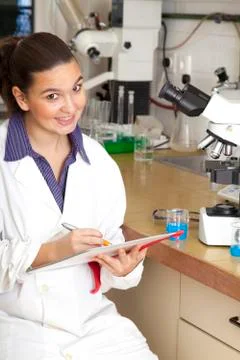 Cute chemist working in laboratory Stock Photos