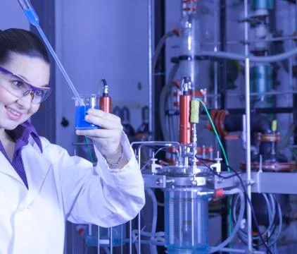 Cute chemist working in laboratory Stock Photos