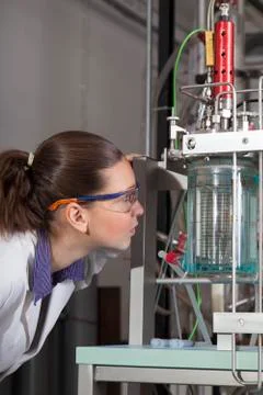 Cute chemistchecks instruments in laboratory. Photos