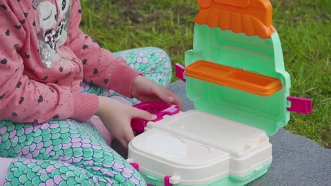 Cute child assembling portable doctor playset in the park Vidéo 341224606