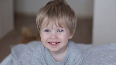 Cute child boy laughing, clapping hands and having fun at home.  Stock Footage 93863953