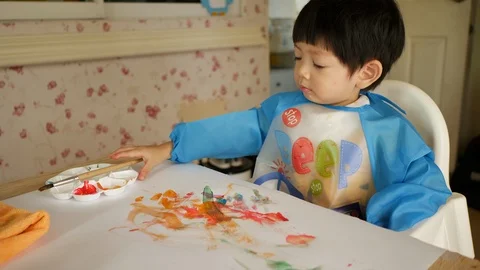 Cute child boy learning art drawing with watercolor Stock Footage 99132045