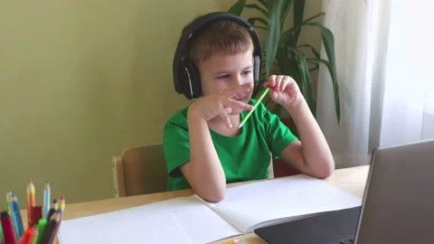 Cute child boy study online on computer while quarantine. Stock Footage 144400241
