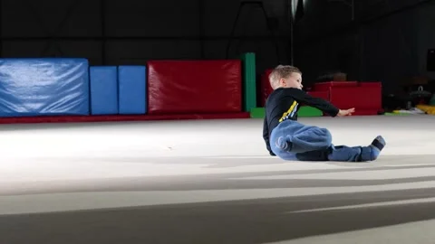 Cute child boy training inside sport hall Stock Footage 151328089
