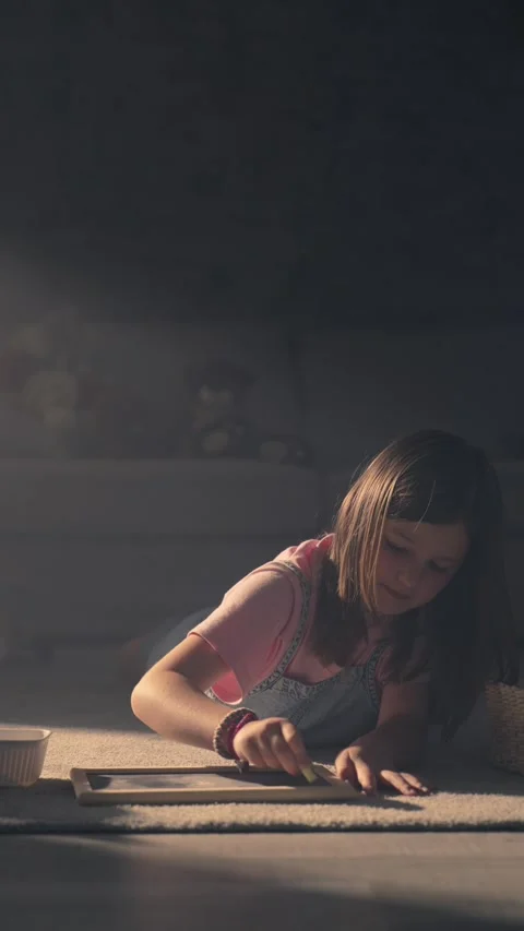 Cute child drawing lying on the floor Stock Footage 243813409