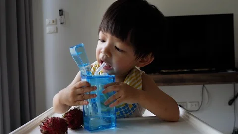 Cute child drinking water Stock Footage 92629697