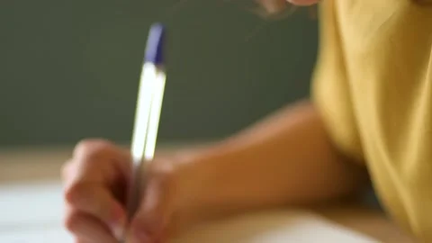 Cute child during online study. Girl has homework at home schooling. Teenager Stock Footage 163329618