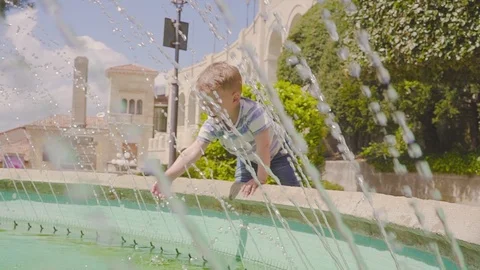 Cute child happy fun playing water splashing in san marino Video stock 108780747