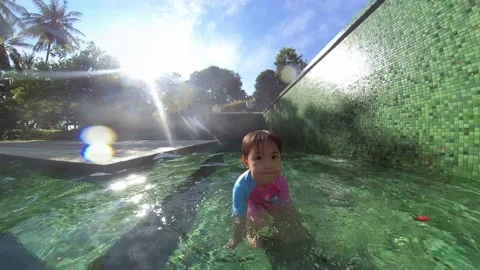 Cute child having fun in swimming pool Video stock 160187103