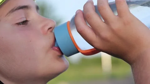 Cute child kid drinking water from sport bottle Stock-Footage 157097494