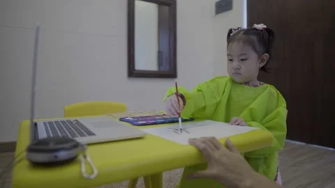 Cute child learning to paint using water color Stock Footage 158990224