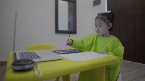 Cute child learning to paint using water color Stock Footage 158990249