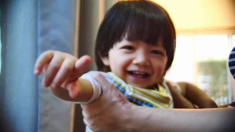 Cute child playing joyful with mom in home Stock Footage 89772020